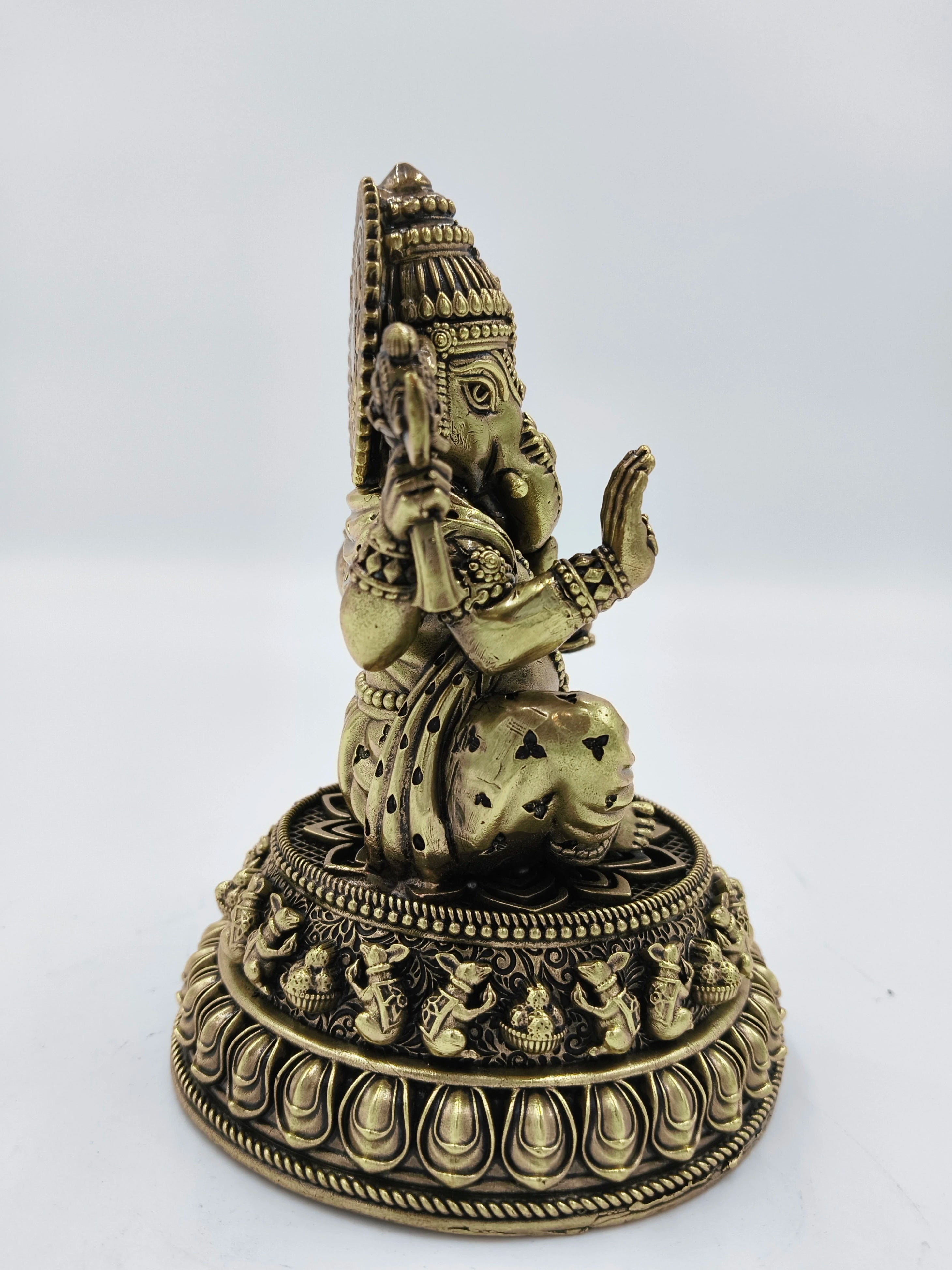 Side view of medium brass Siddhi Ganapati statue on intricate base