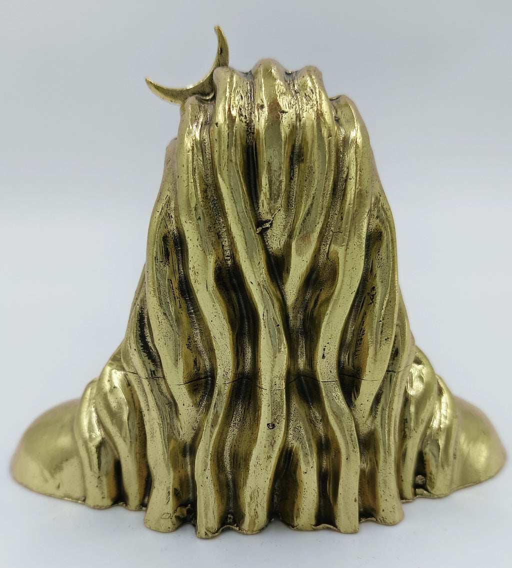Back view of small brass Adiyogi sculpture with detailed textures