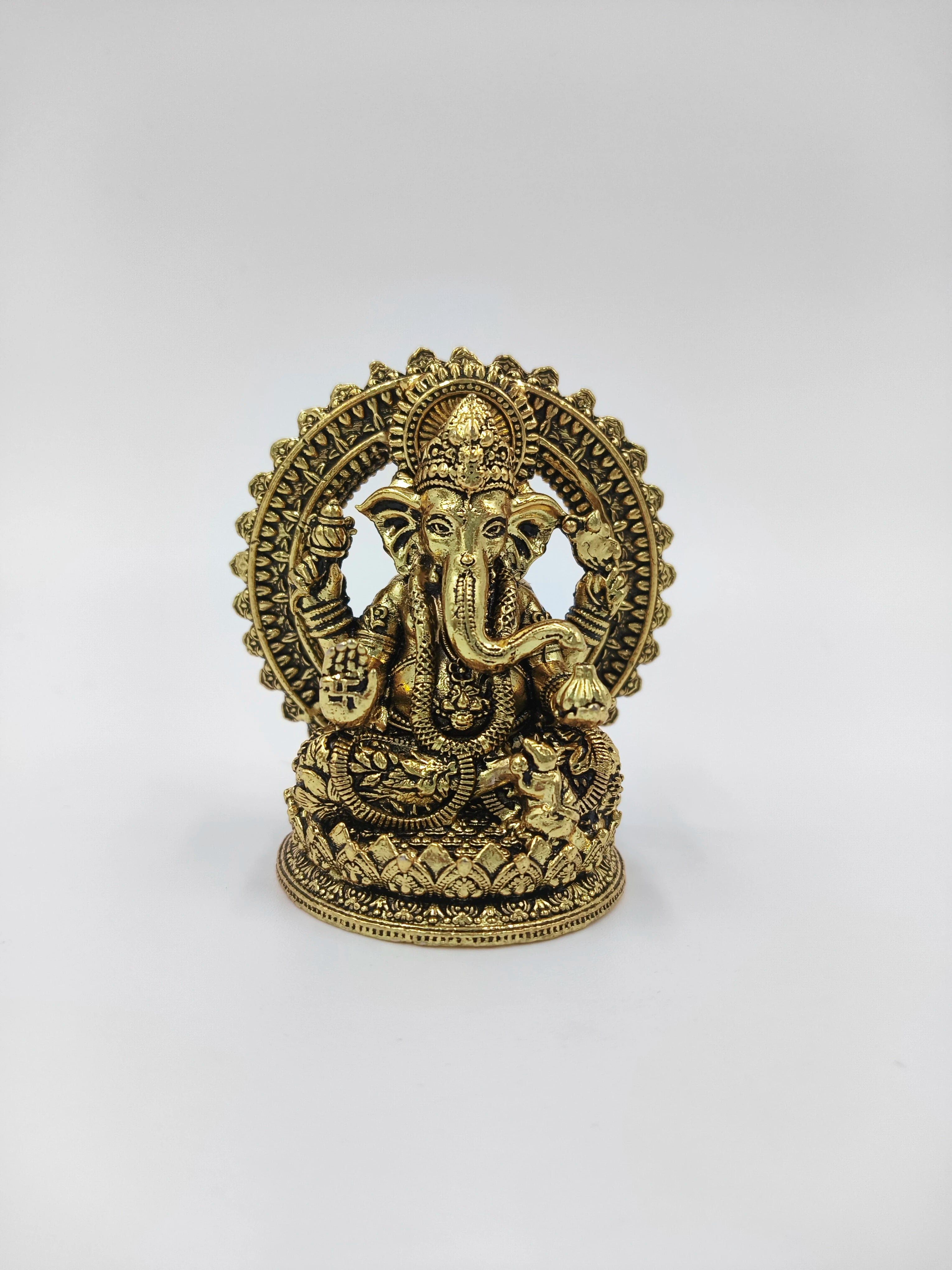 Mini brass Prabhavali statue of Hindu deity Ganesh with intricate detailing