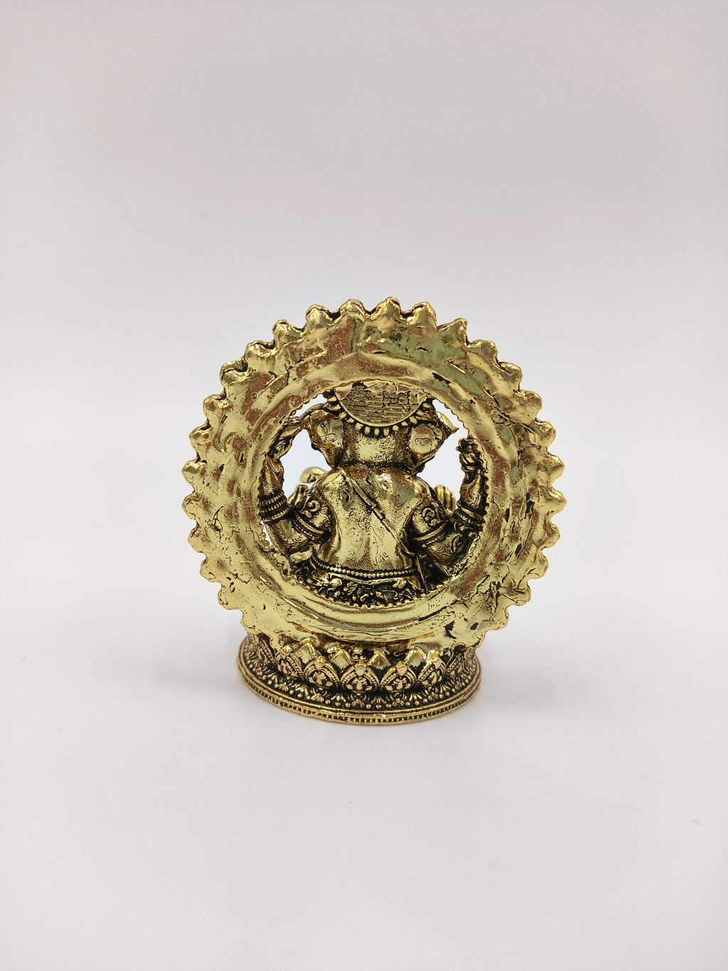 Mini brass Prabhavali Ganesh statue showing back view with intricate detailing