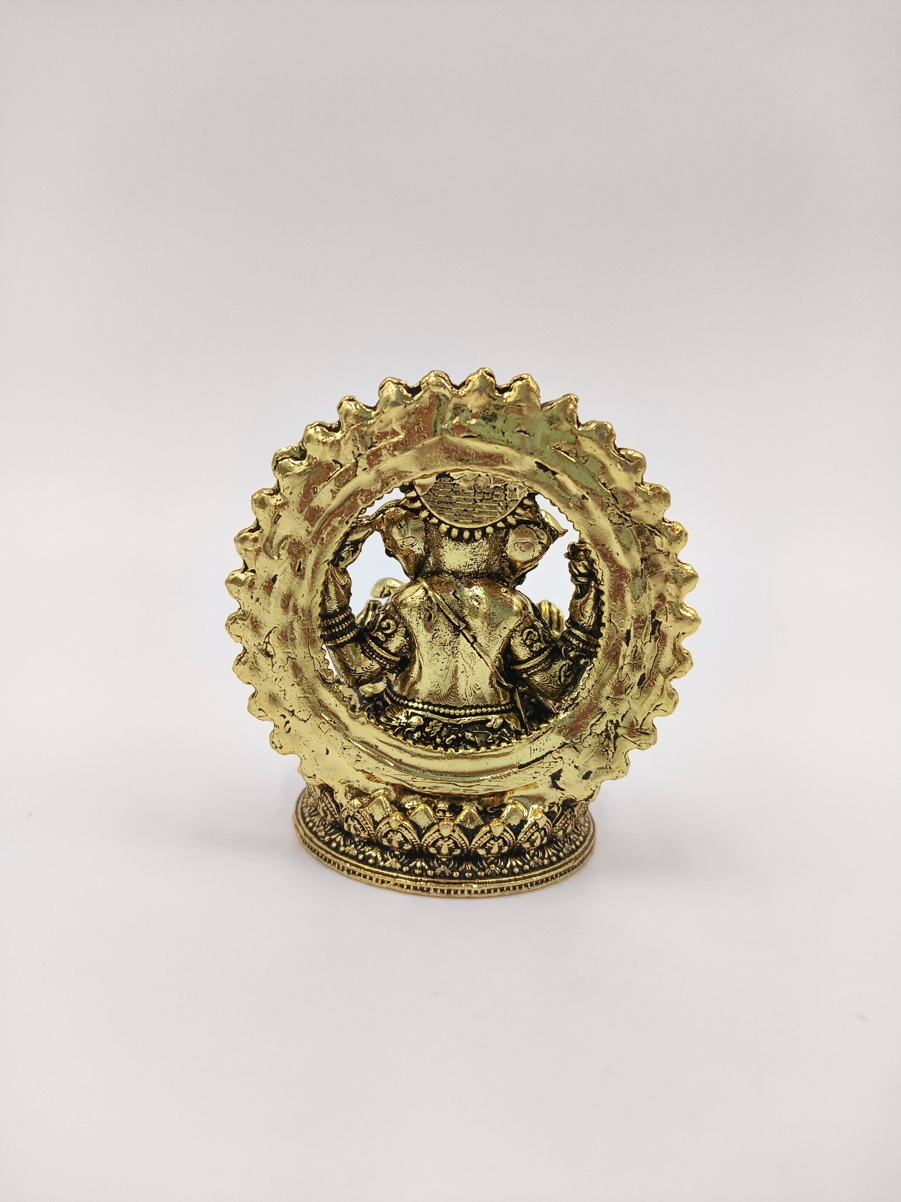 Mini brass Prabhavali Ganesh statue showing back view with intricate detailing