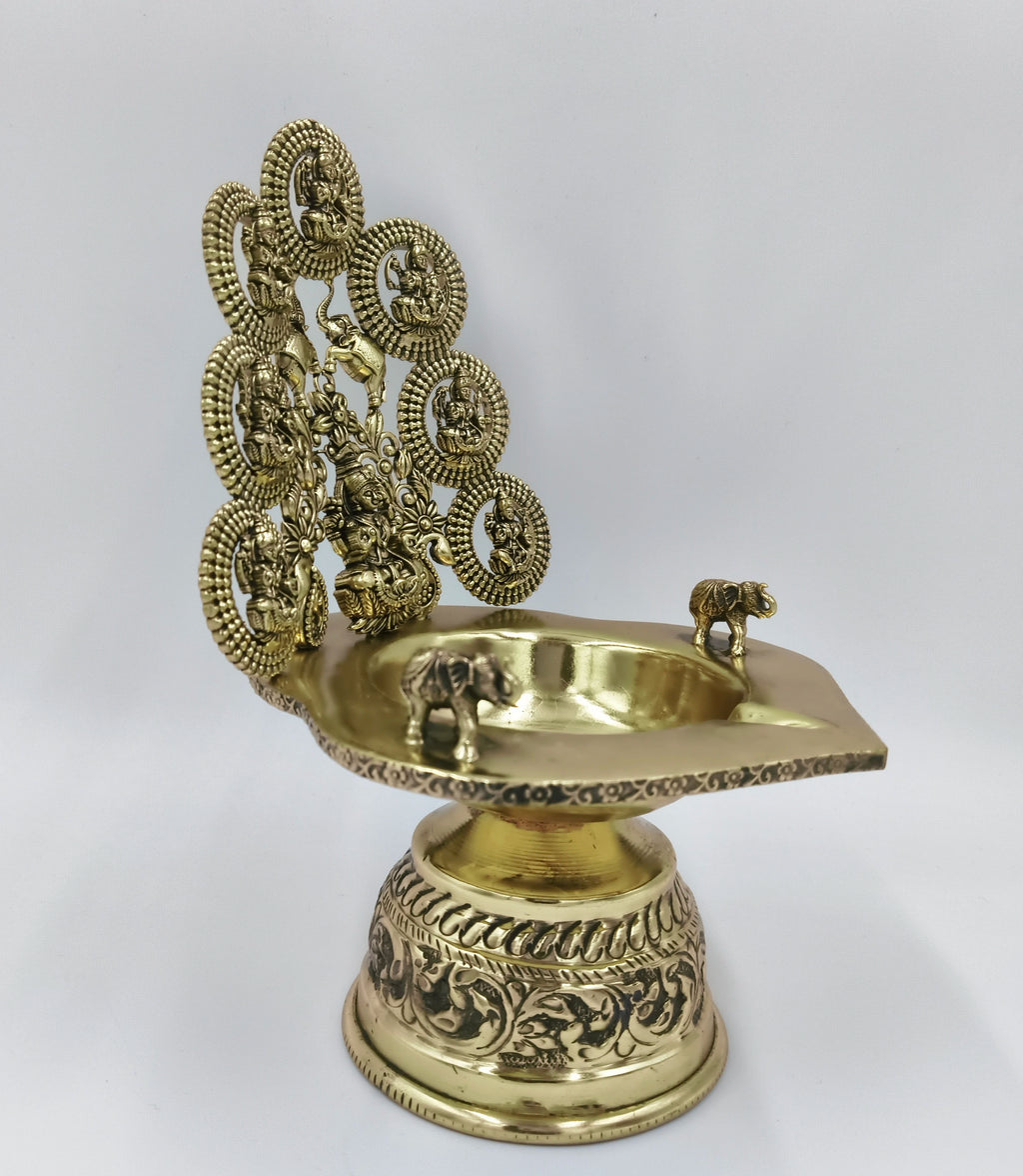 Brass Astalakshmi lamp with intricate goddess figures and elephant motifs