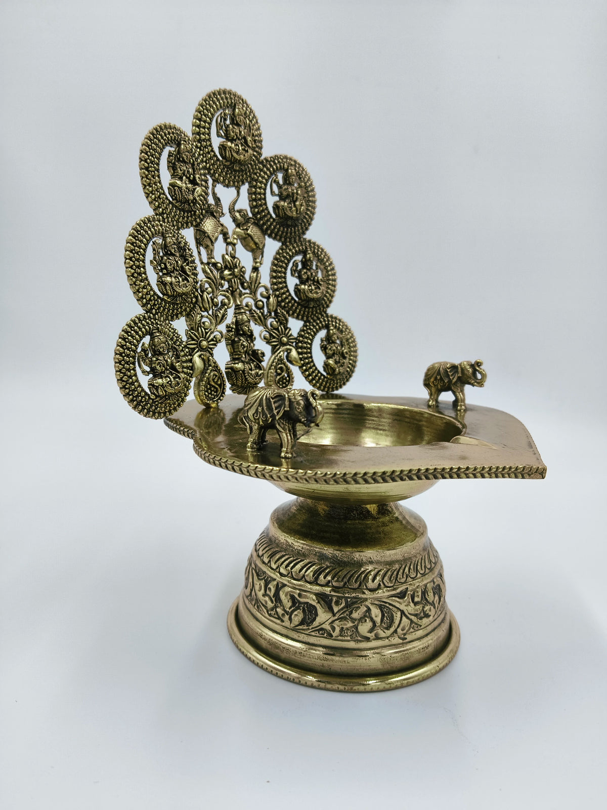 Brass Astalakshmi lamp with nine goddess figures and elephant designs