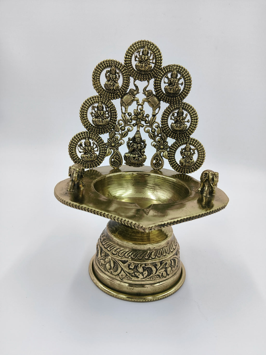 Brass Astalakshmi lamp with seven goddess figures and elephant decorations