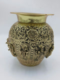 Medium brass Kalash with intricate floral and deity carvings around the body