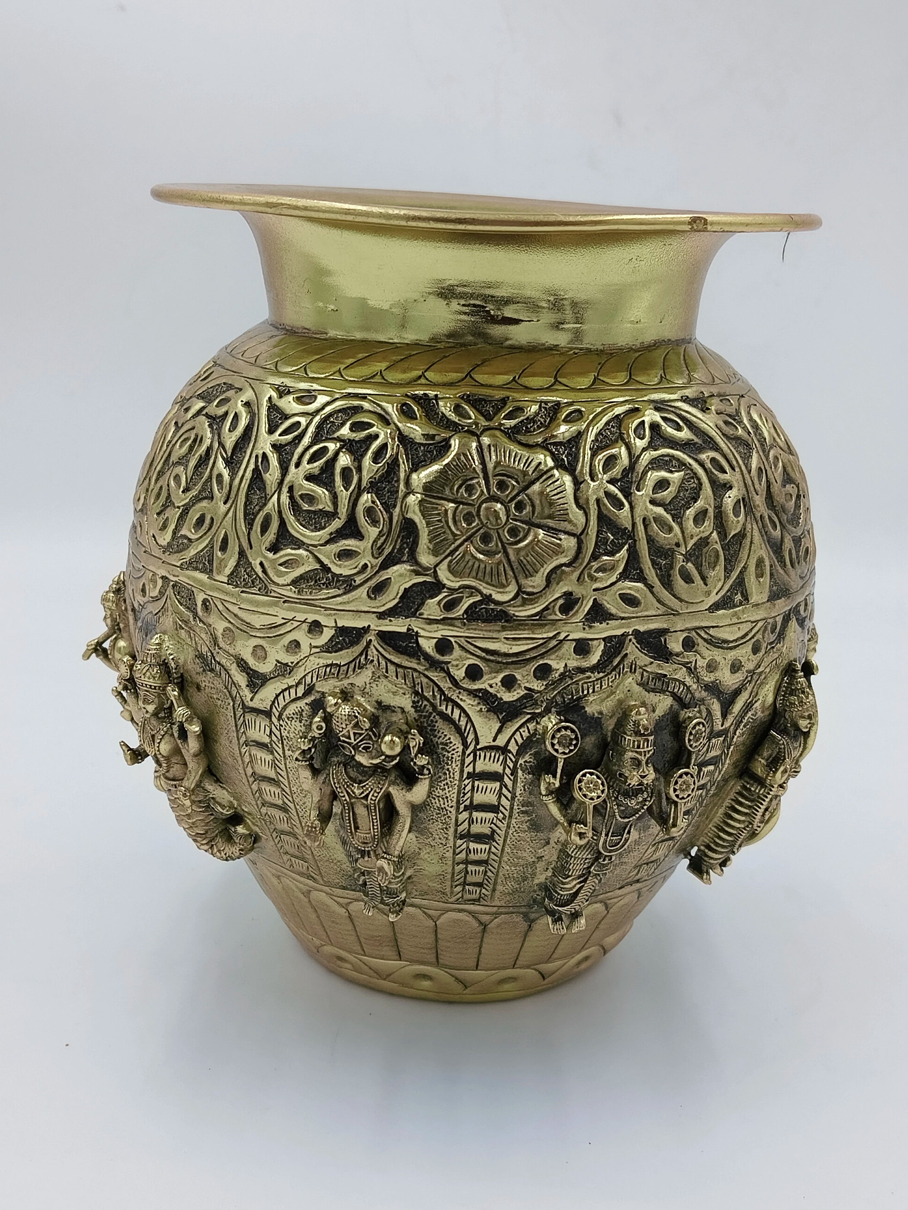 Medium brass Kalash with intricate floral and deity carvings around the body