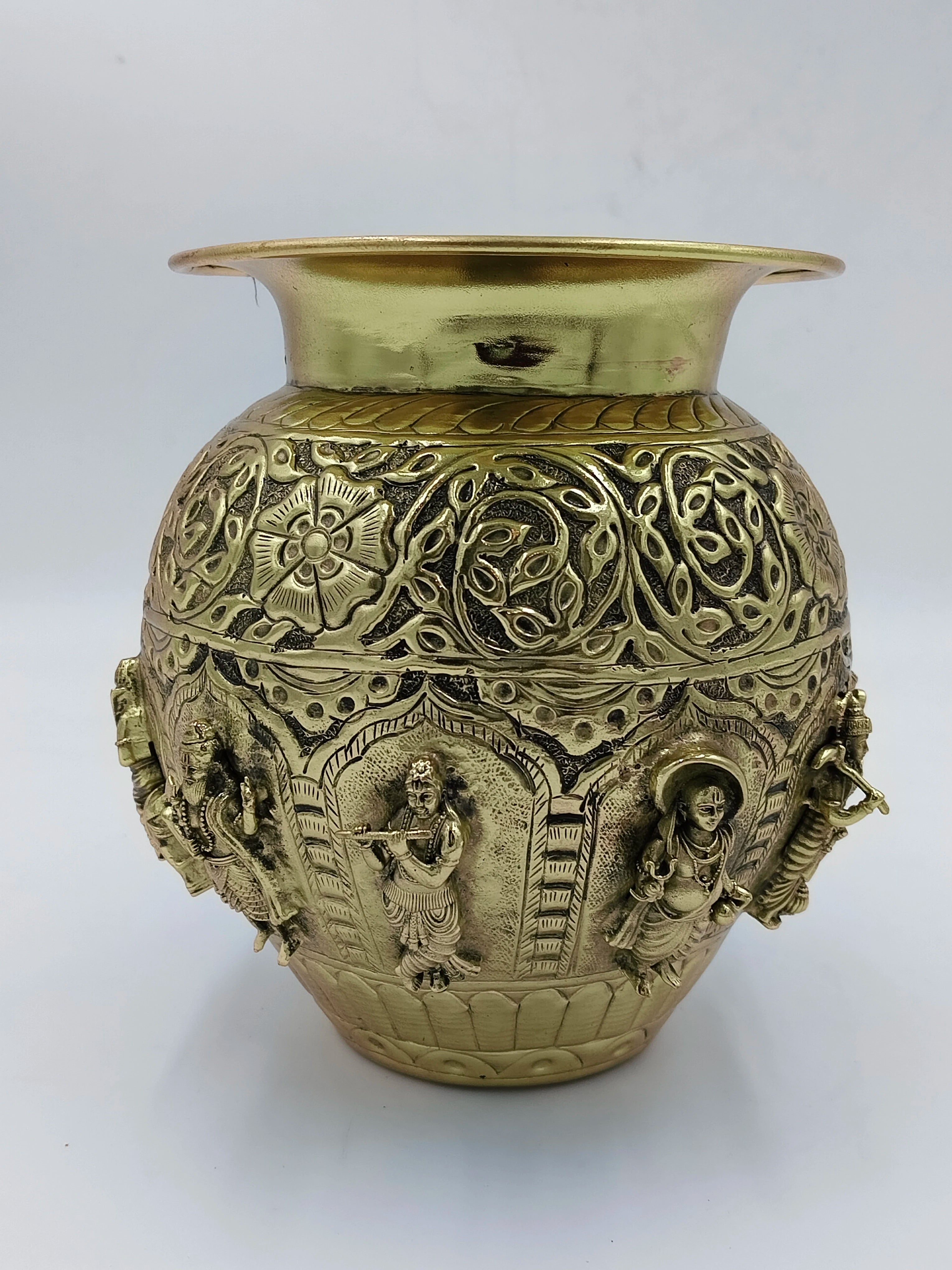 Medium brass Kalash with intricate carvings of Hindu deities and floral patterns