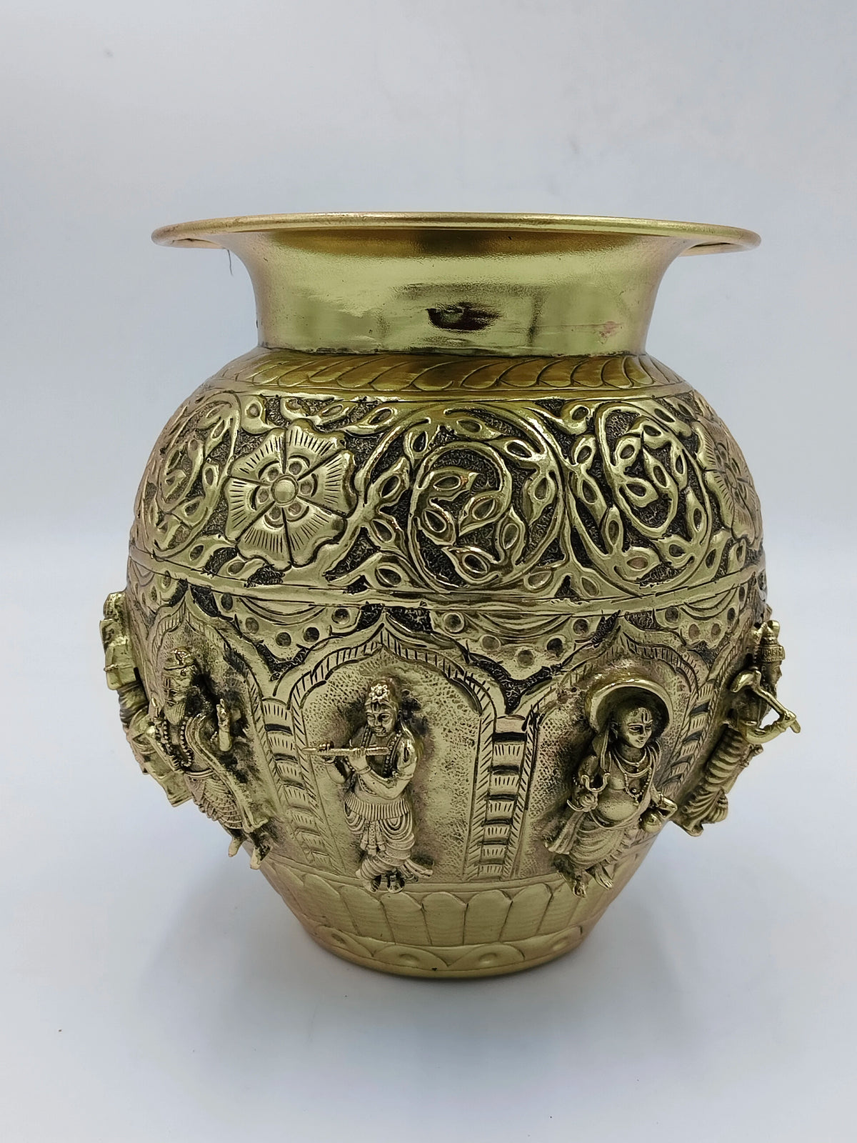 Medium brass Kalash with intricate carvings of Hindu deities and floral patterns