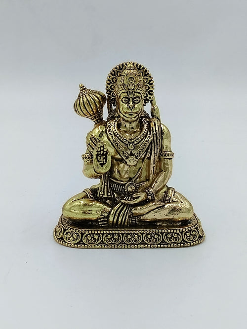 Small brass Hanuman statue seated with mace and detailed decorations