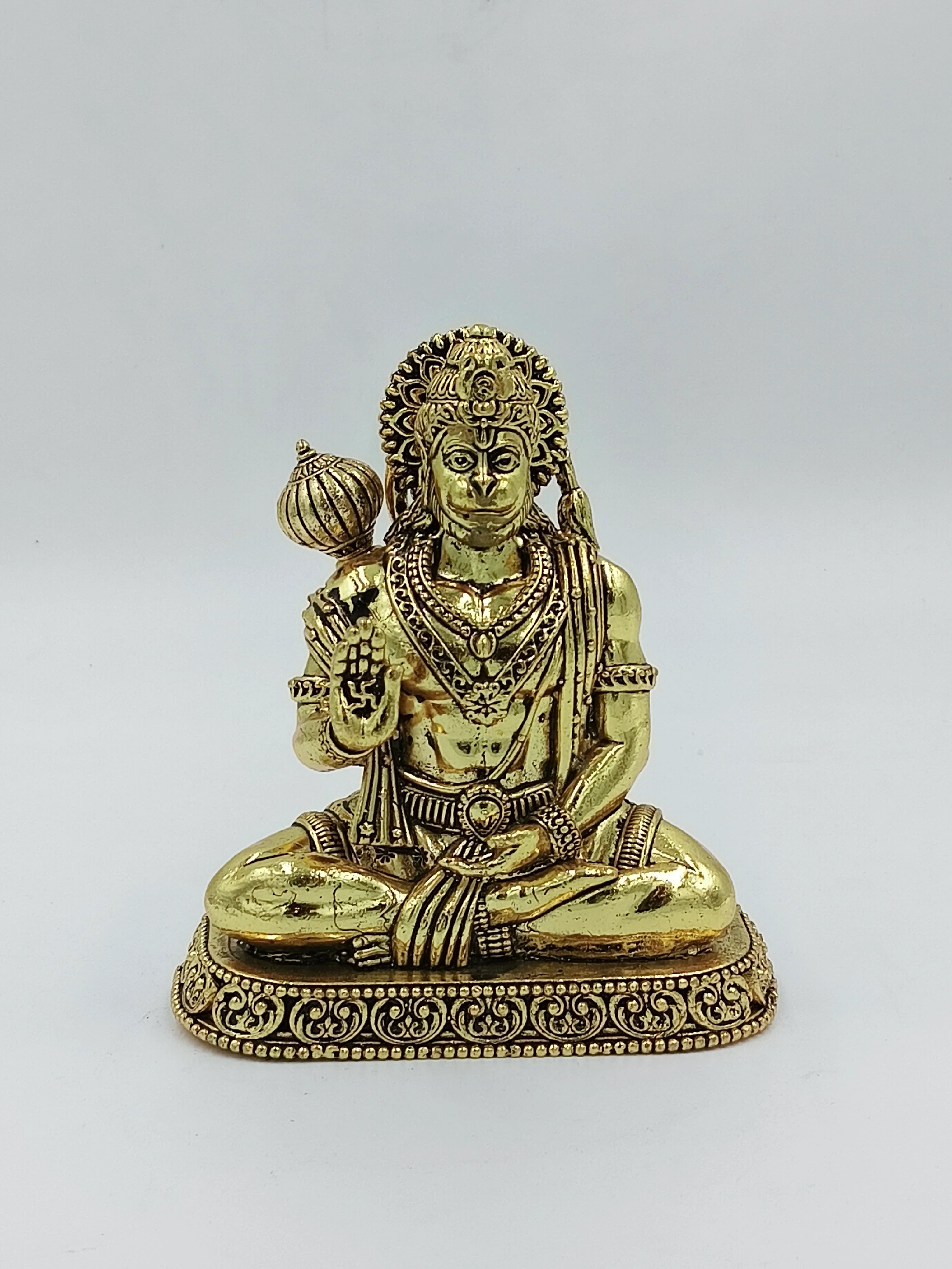 Medium brass statue of Hanuman in seated posture with detailed decorations