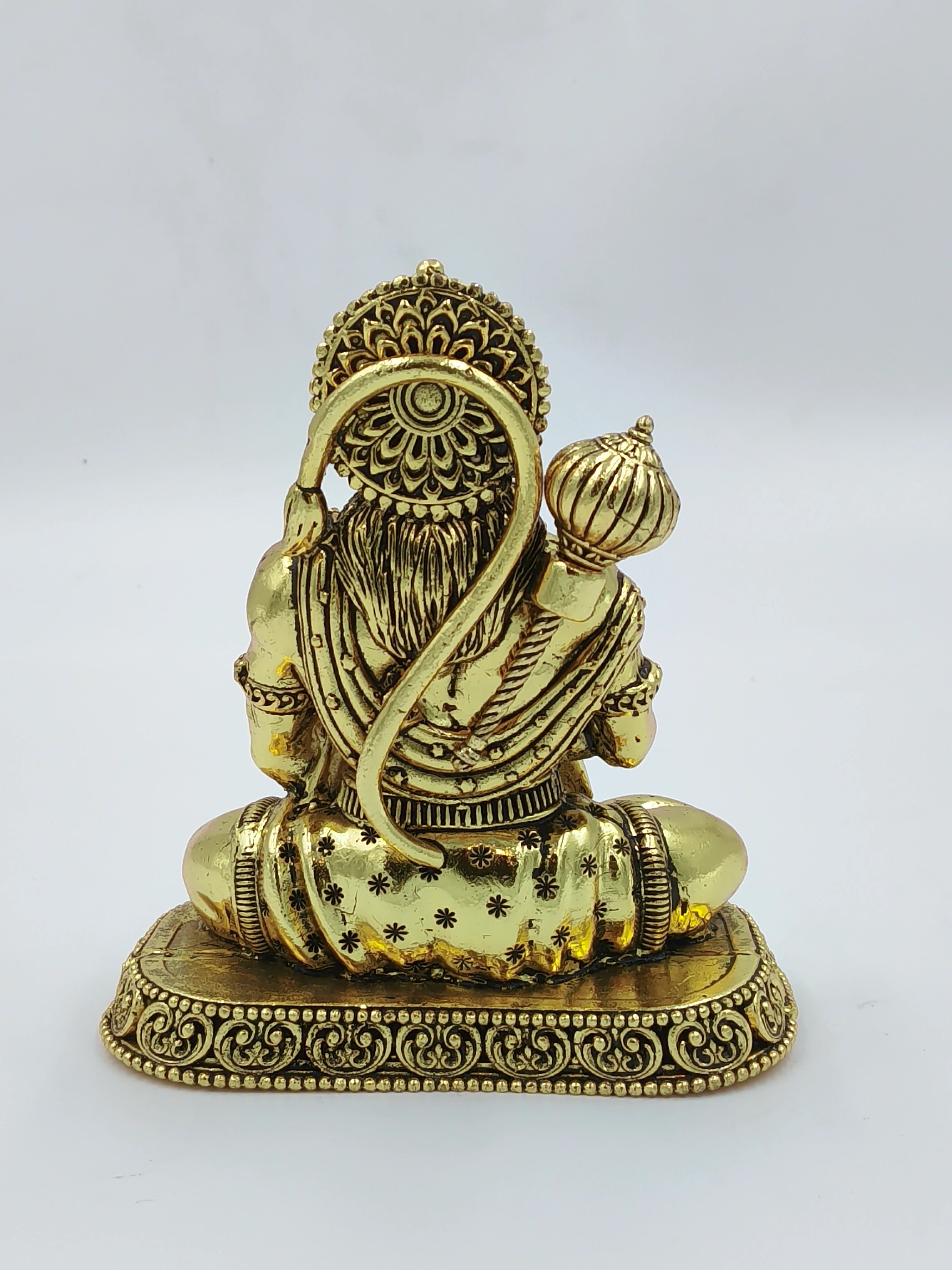 Back view of medium brass Hanuman statue sitting on ornate base