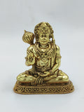 Small brass Hanuman statue seated with raised hand and mace on pedestal