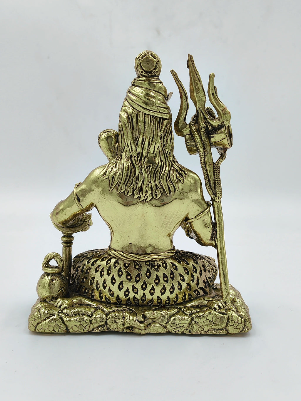 Back view of medium brass Sadashiva statue holding trident and water pot