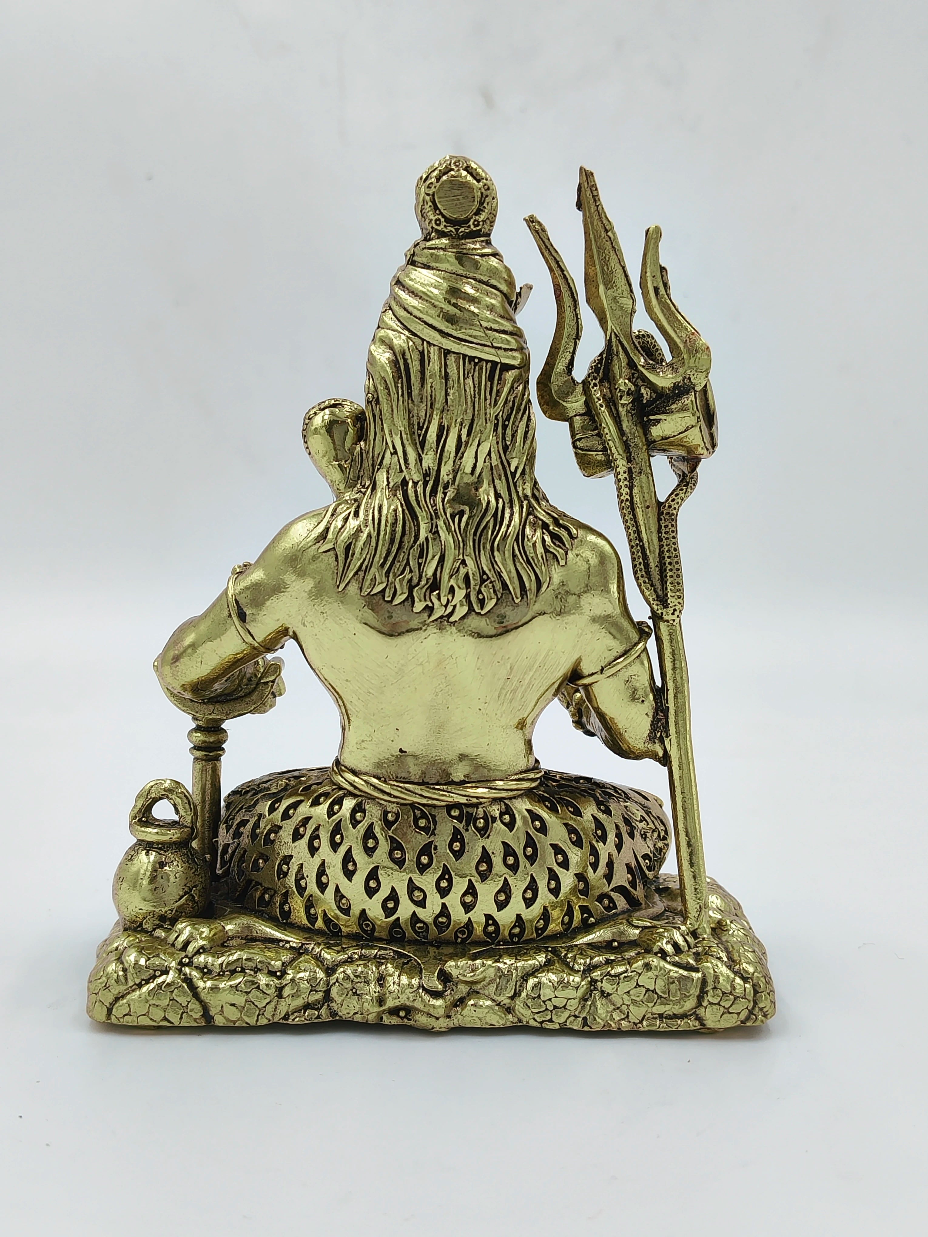 Back view of medium brass Sadashiva statue holding trident and water pot