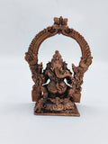 Small brass Ganesh statue with ornate arch frame, front view