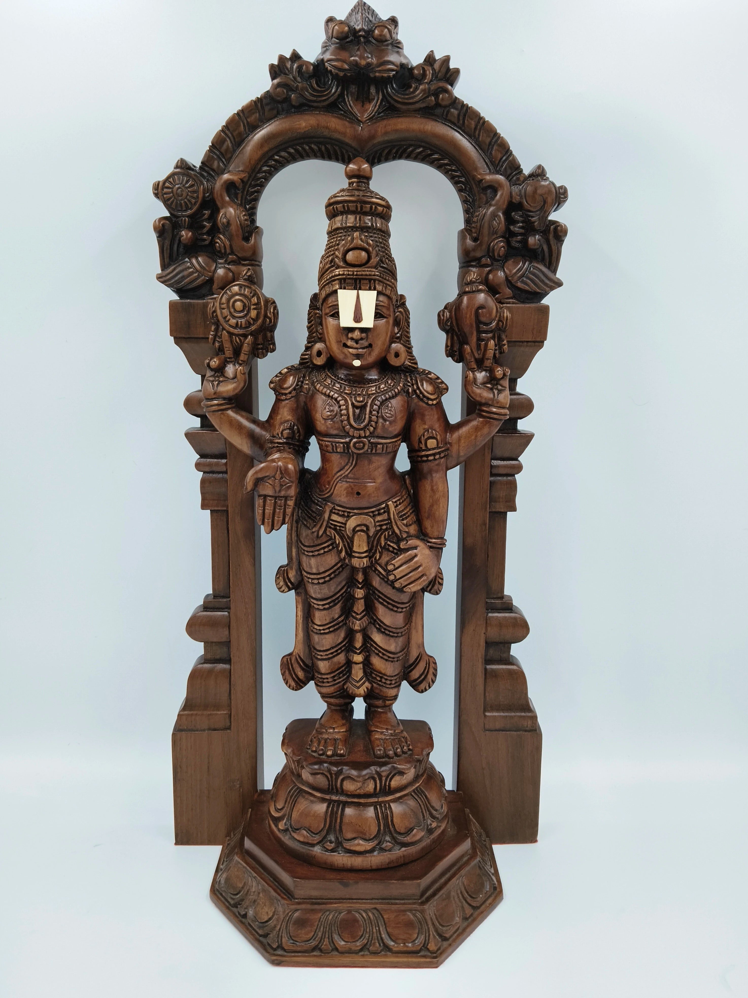 Large teakwood Arch Balaji statue with detailed carvings and decorative arch