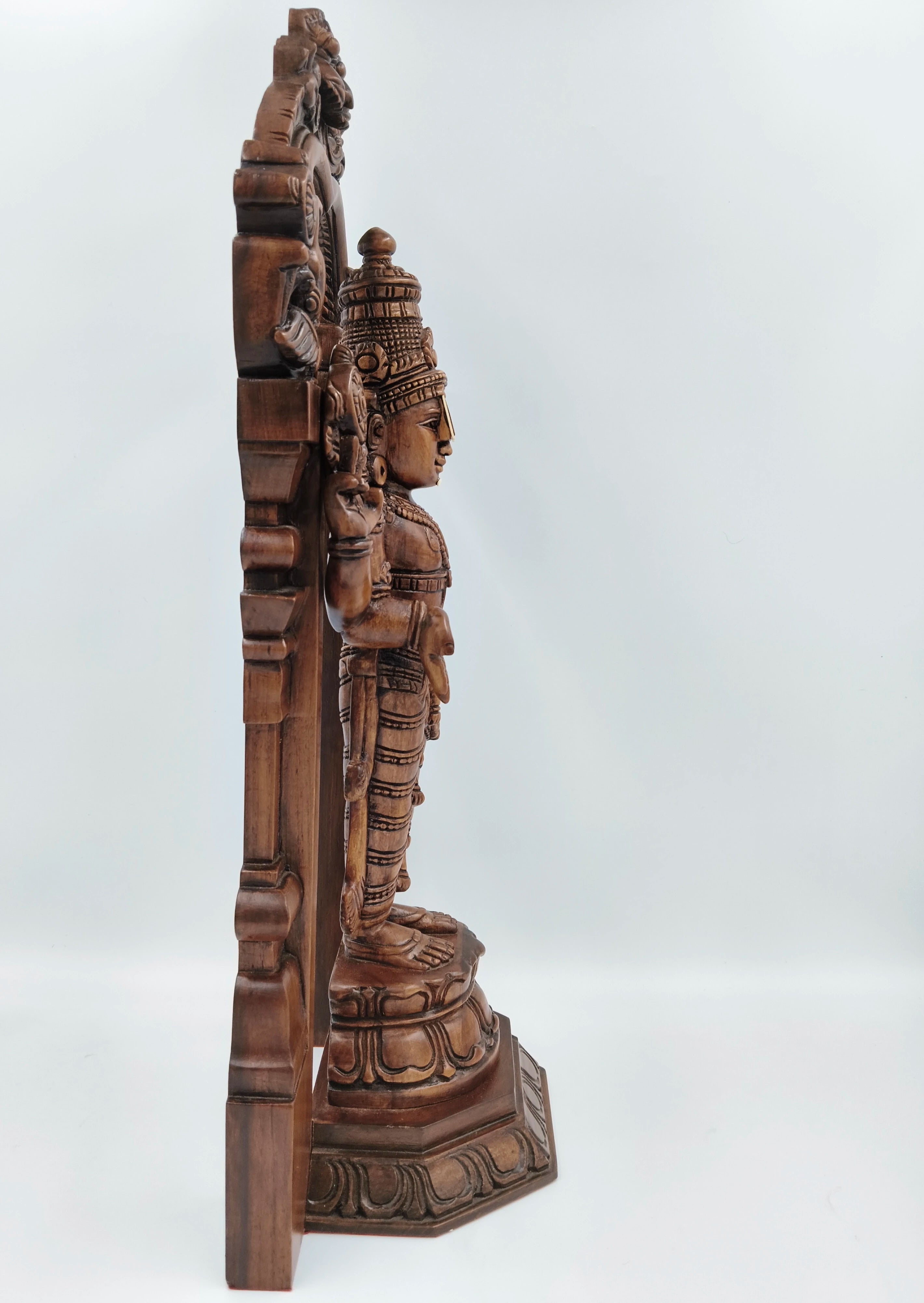 Side view of large teakwood Arch Balaji spiritual statue