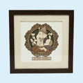Small wood art picture of Ganesh deity in dark wooden frame