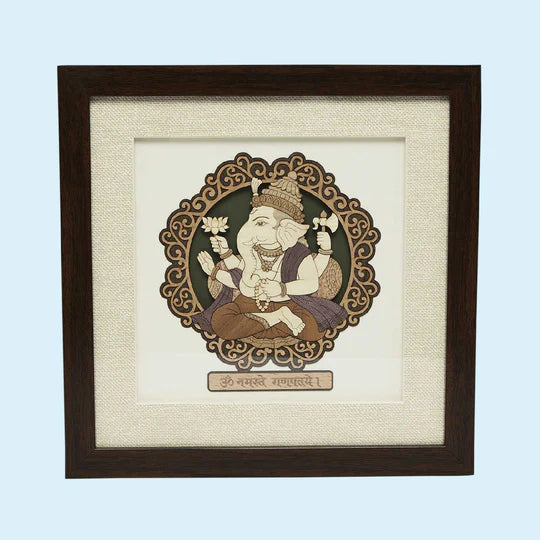 Small wood art picture of Ganesh deity in dark wooden frame
