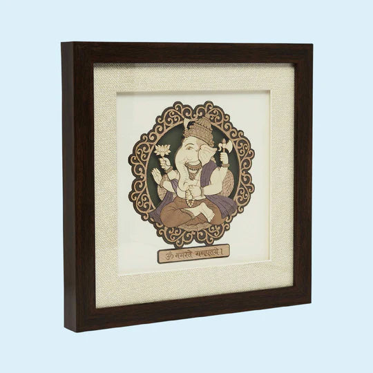 Wooden framed tabletop art featuring a detailed Ganesh figure in traditional style