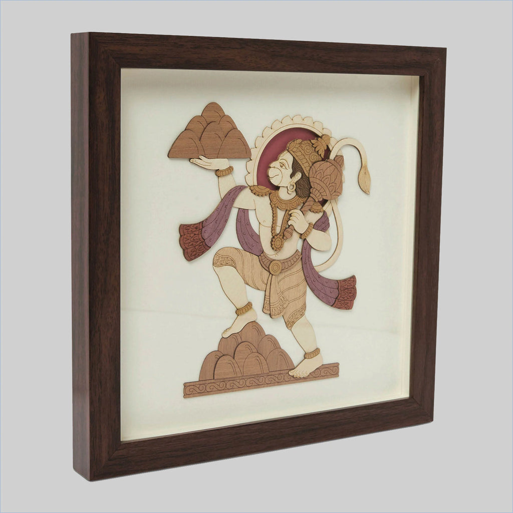 Framed wood art picture of Hanuman holding a mountain in a side view