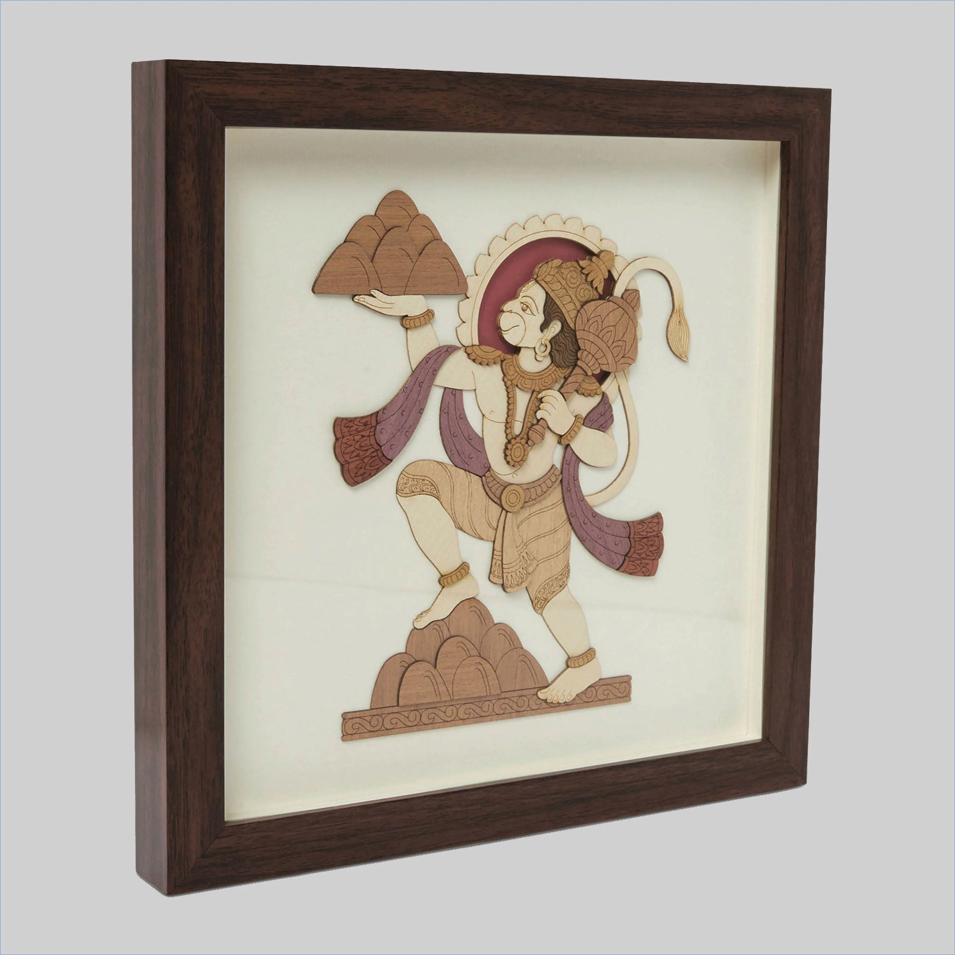 Framed wood art picture of Hanuman holding a mountain in a side view
