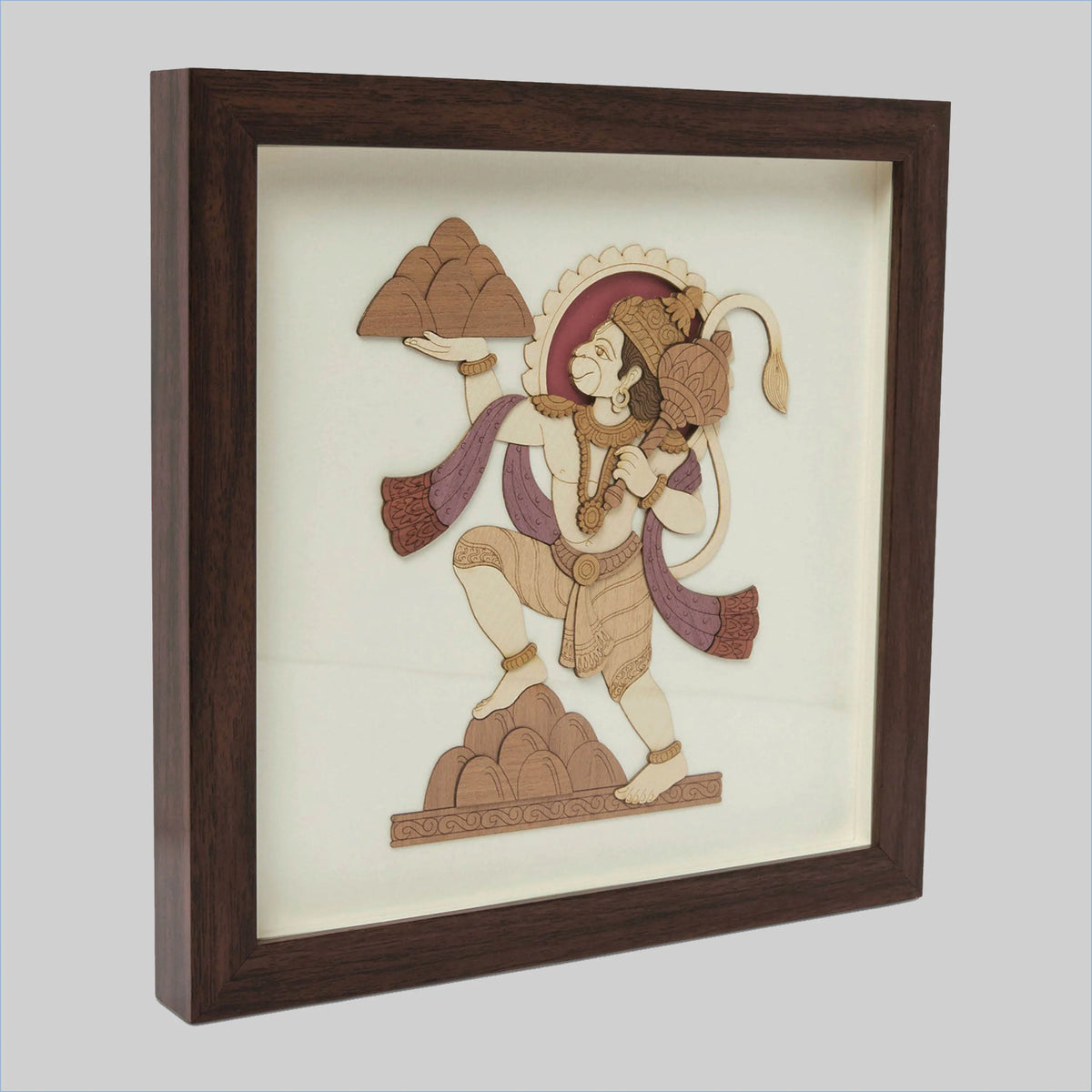 Framed wood art picture of Hanuman holding a mountain in a side view