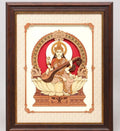 Large wooden wall art depicting Saraswathi seated on a lotus with veena