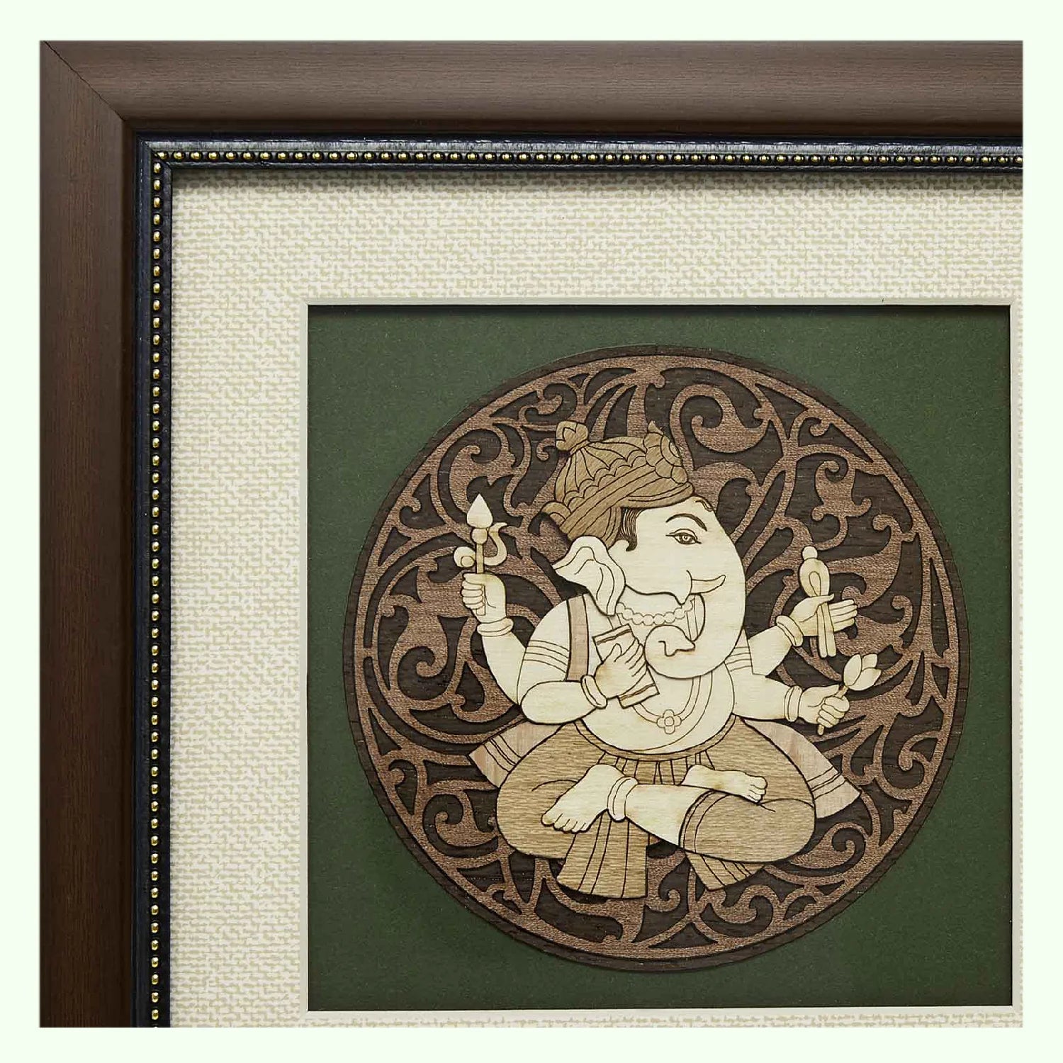 Wooden framed art of Pothi Ganesh with intricate circular design background