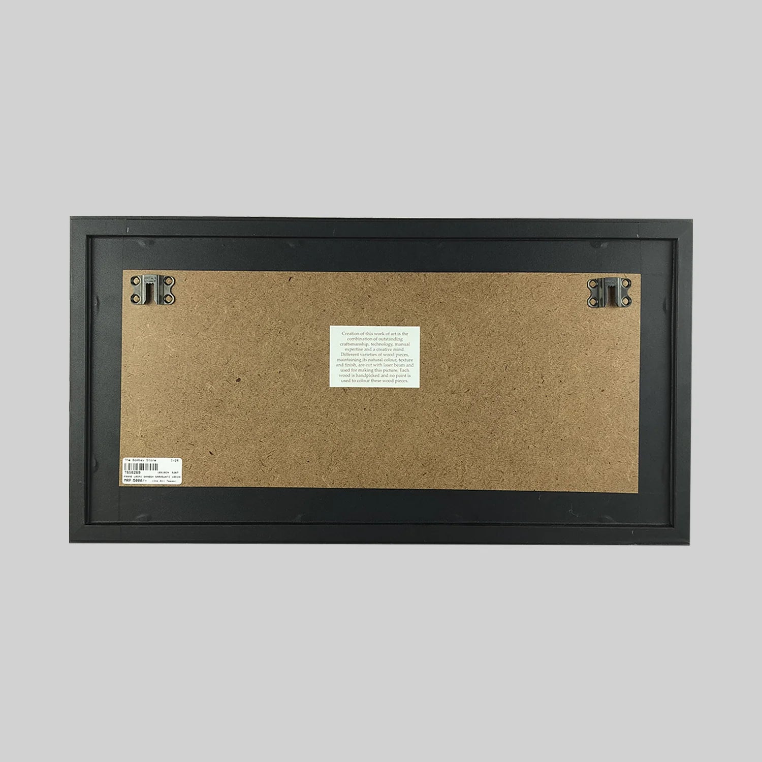 Back view of wood art frame with mounting hardware and label
