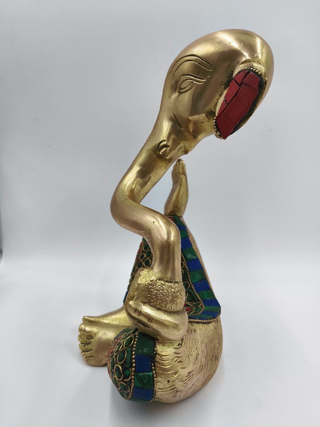 Side view of large brass modern Ganesha statue with colorful inlay designs