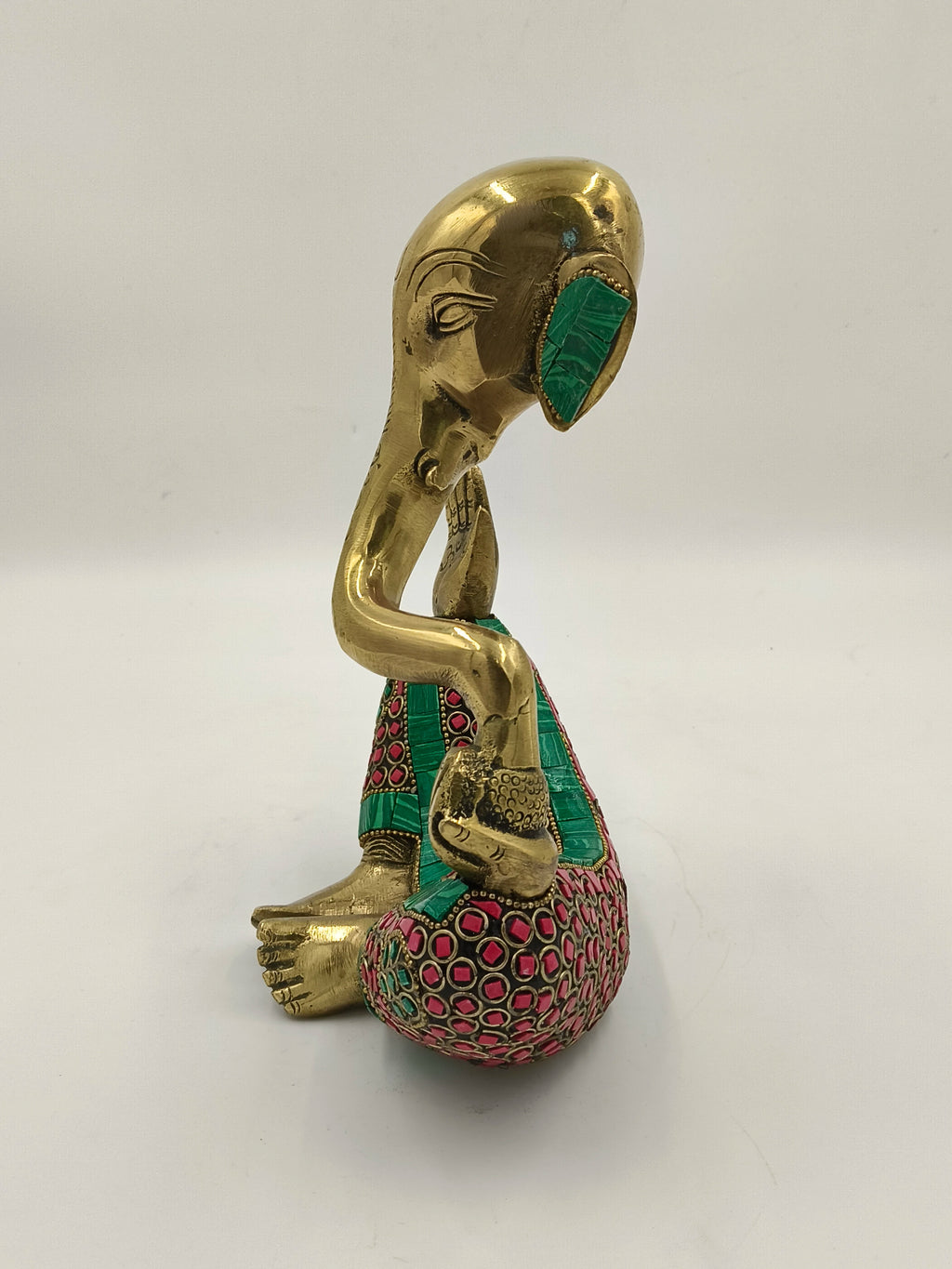 Side view of large brass modern Ganesha sculpture with colorful inlay design