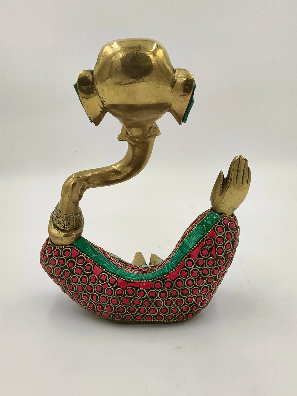 Large brass modern Ganesha sculpture with red and green decorations, side view