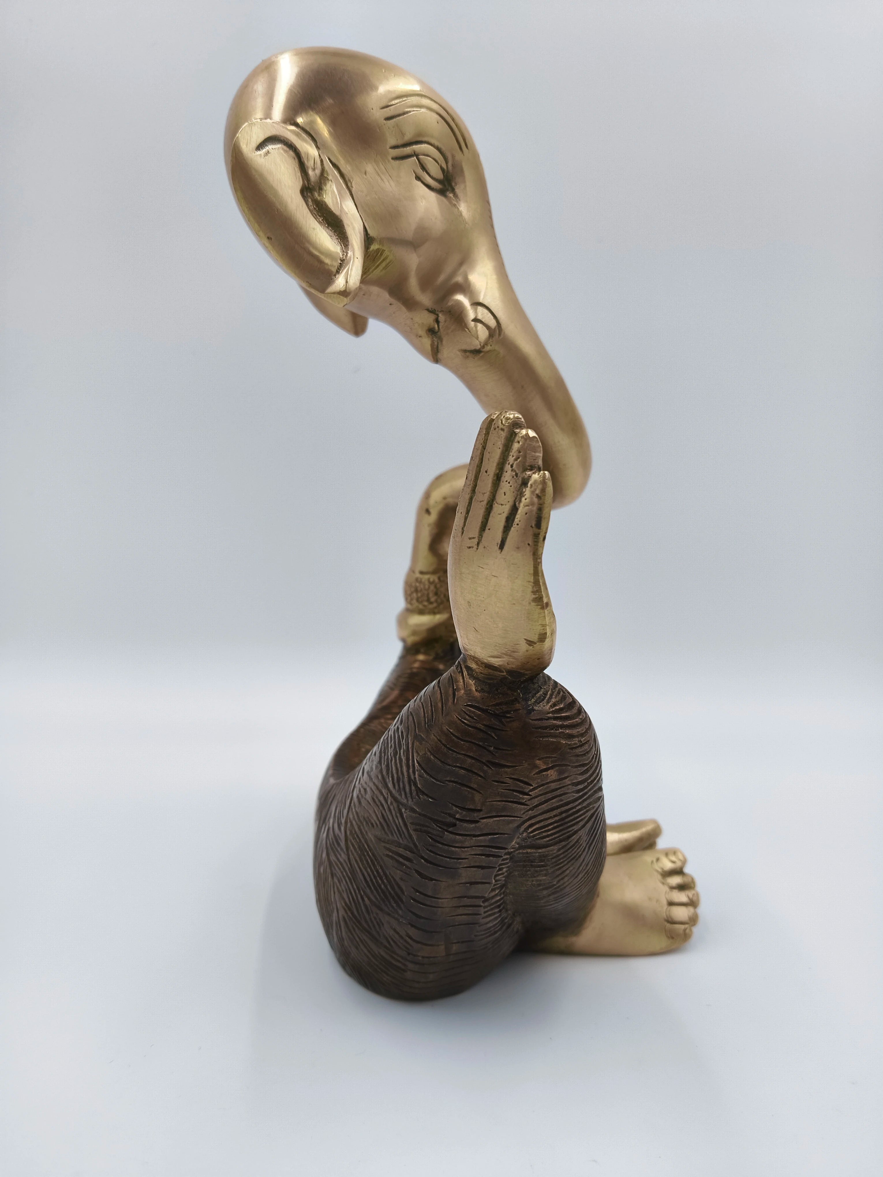 Large brass modern Ganesha statue with raised hand and detailed carving