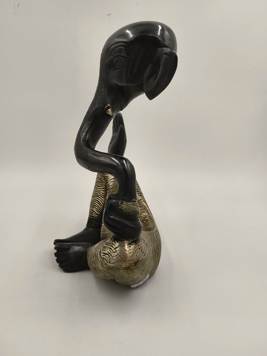 Large brass modern sculpture of Ganesh sitting with black and gold finish