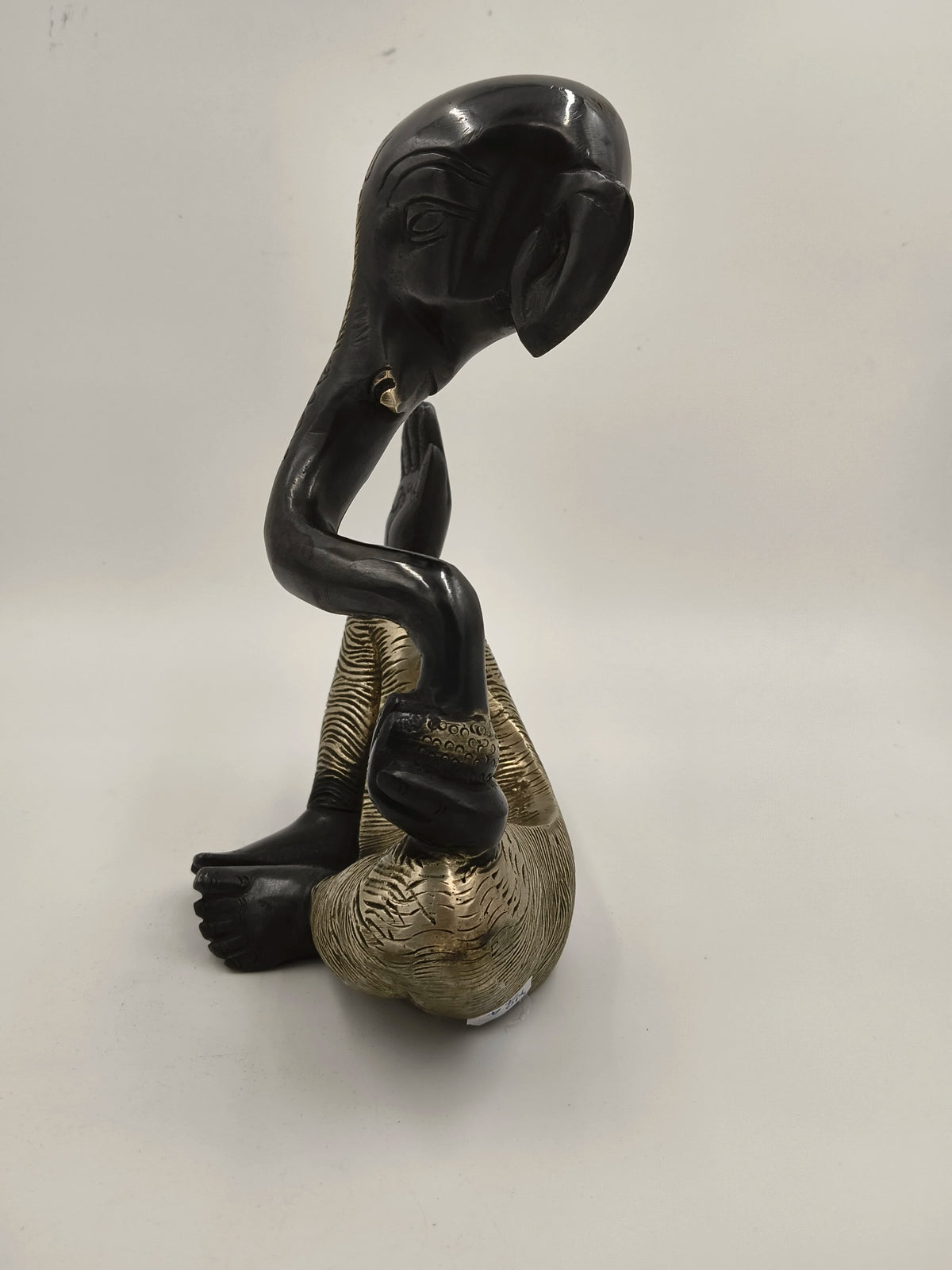 Large brass modern sculpture of Ganesh sitting with black and gold finish
