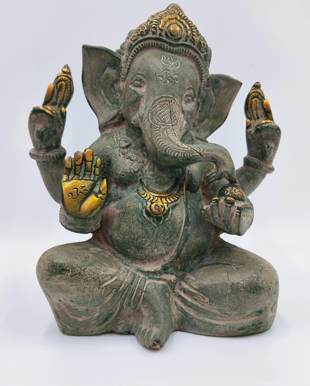 Large brass Appu Ganesha statue with gold accents sitting cross-legged