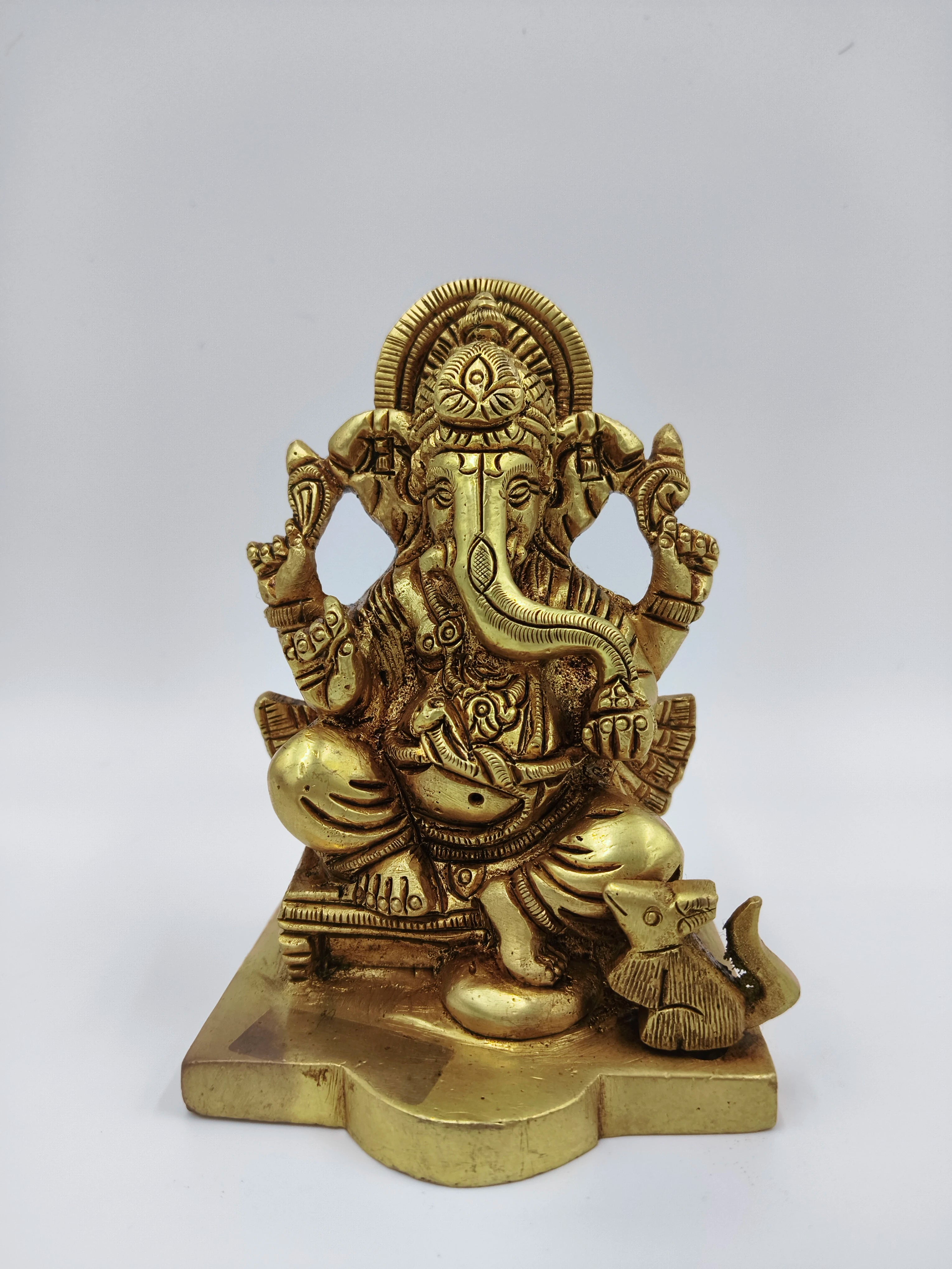 Small brass Ganesha sitting statue with a mouse on base, front view