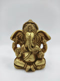 Small brass statue of Ganesh seated with detailed craftsmanship
