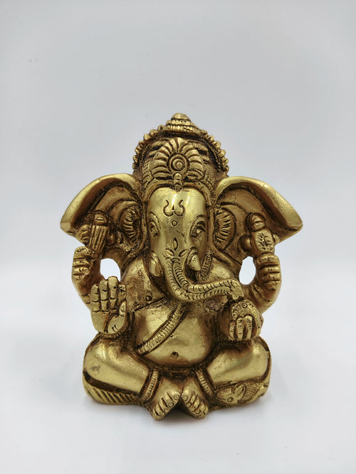 Small brass statue of Ganesh seated with detailed craftsmanship