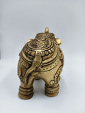 Rear view of medium-sized brass elephant figurine with detailed carvings