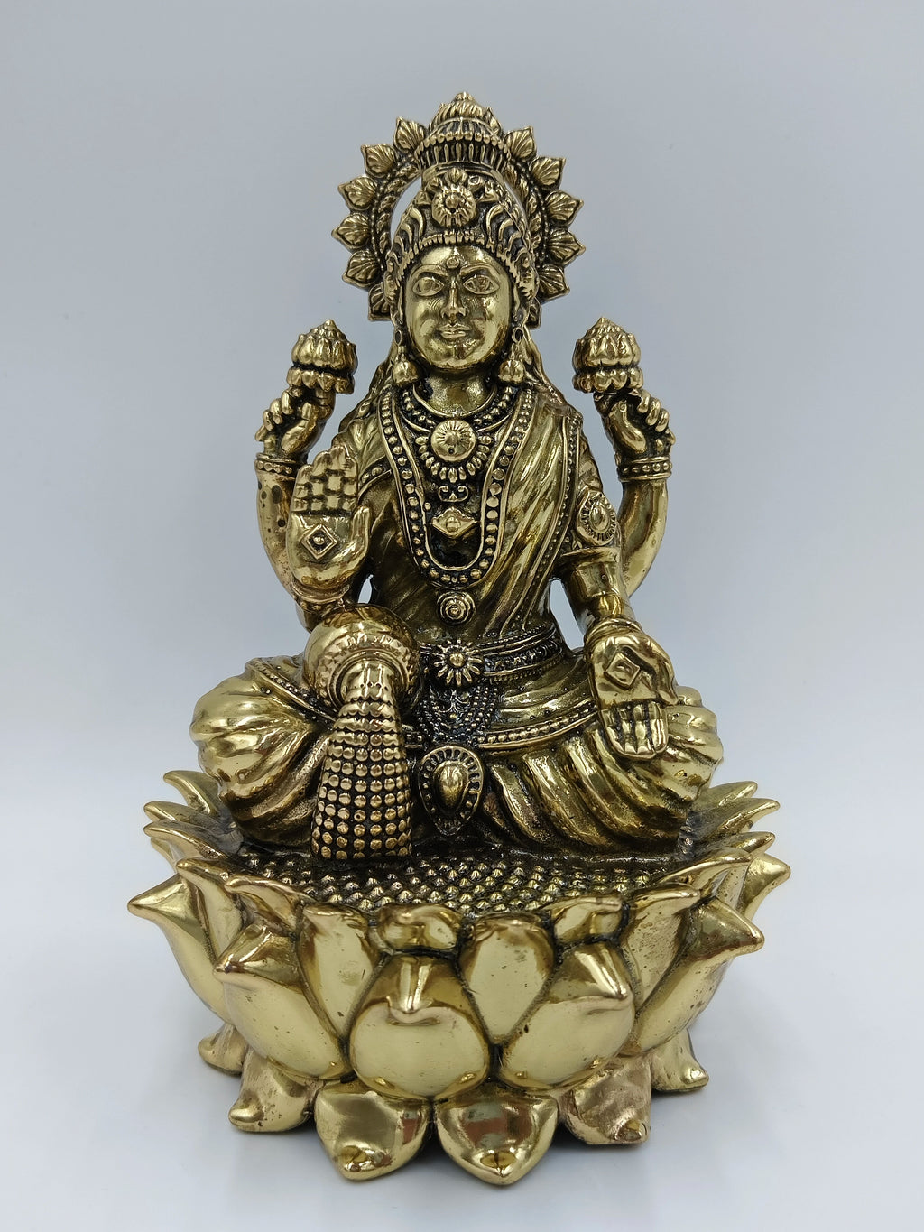 Medium brass statue of Goddess Lakshmi seated on a lotus flower