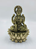 Brass sculpture of Goddess Lakshmi seated on a lotus flower