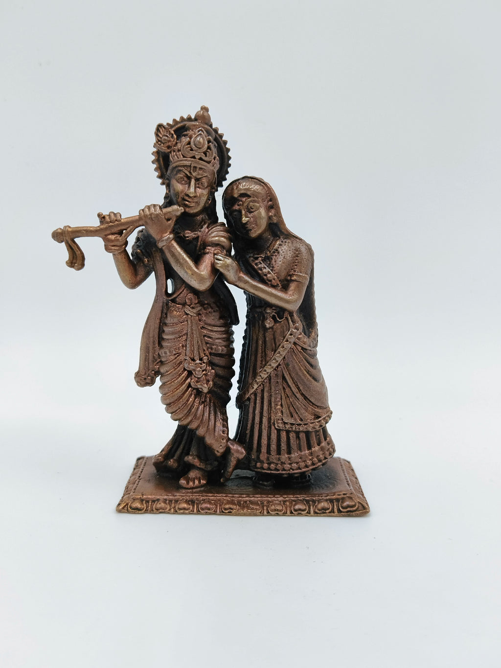 Small copper brass standing sculpture of Radha Krishna playing flute on rectangular base