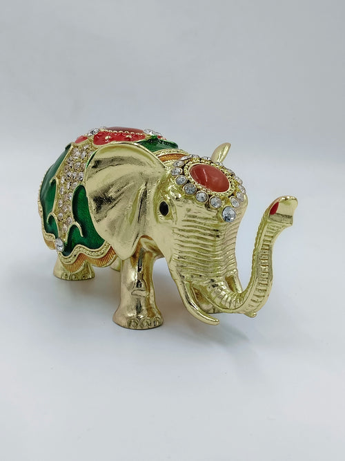 Small brass elephant figurine with copper enamel and rhinestone accents side view
