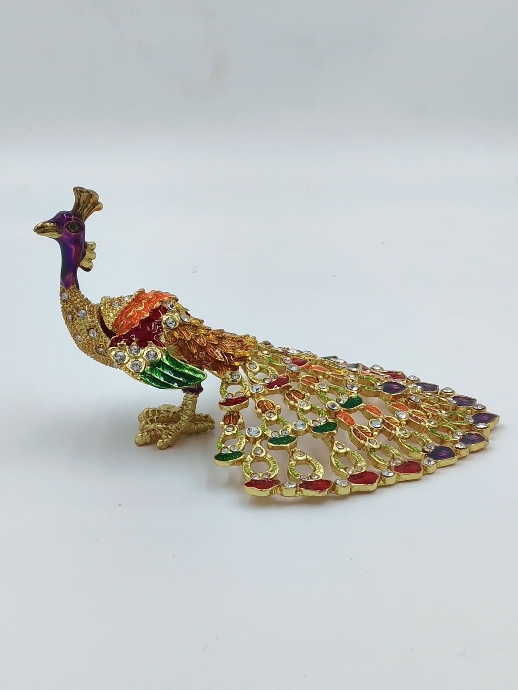 Small brass peacock figurine with copper enamel and decorative stones