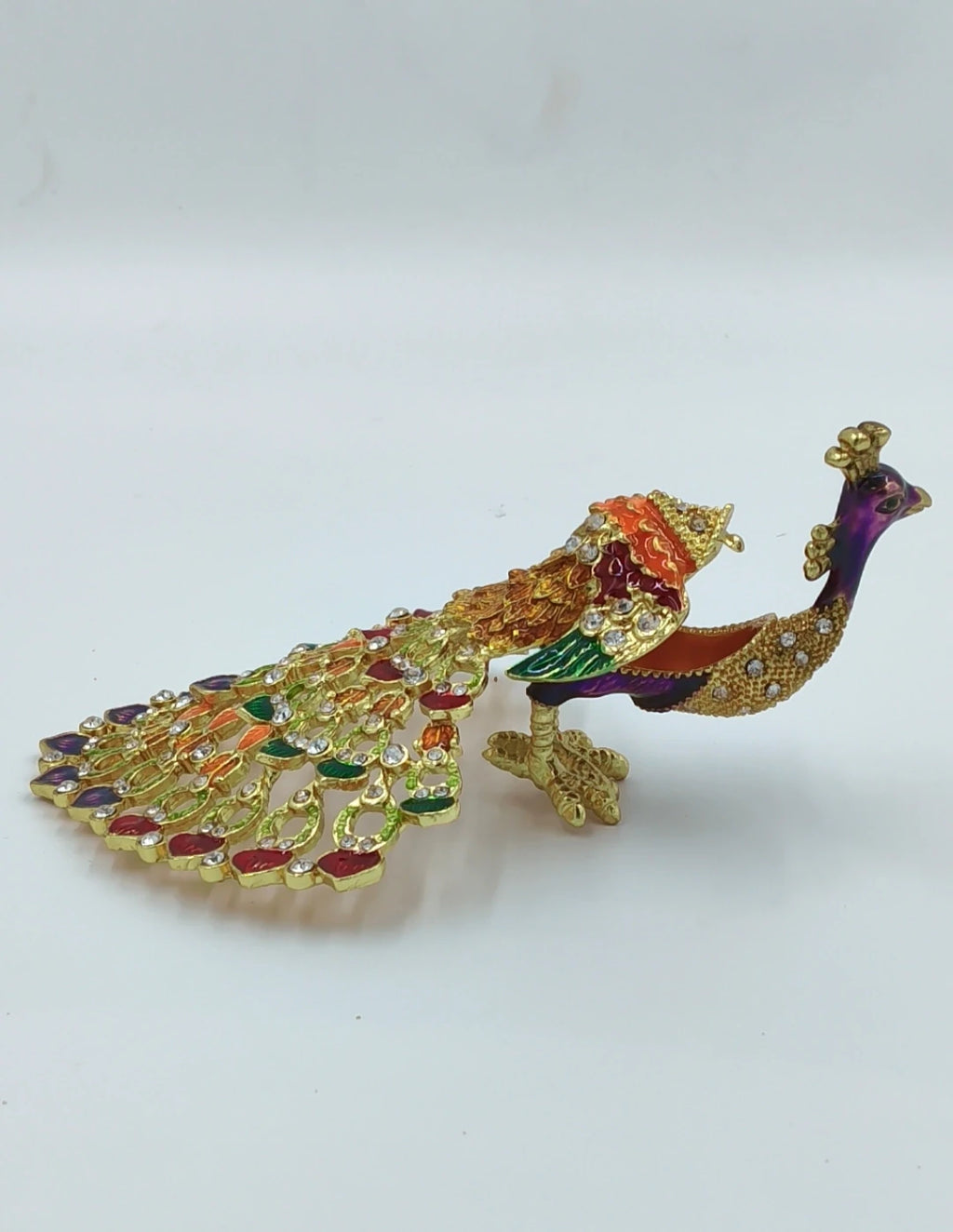 Small brass peacock figurine with colorful copper enamel and rhinestones side view
