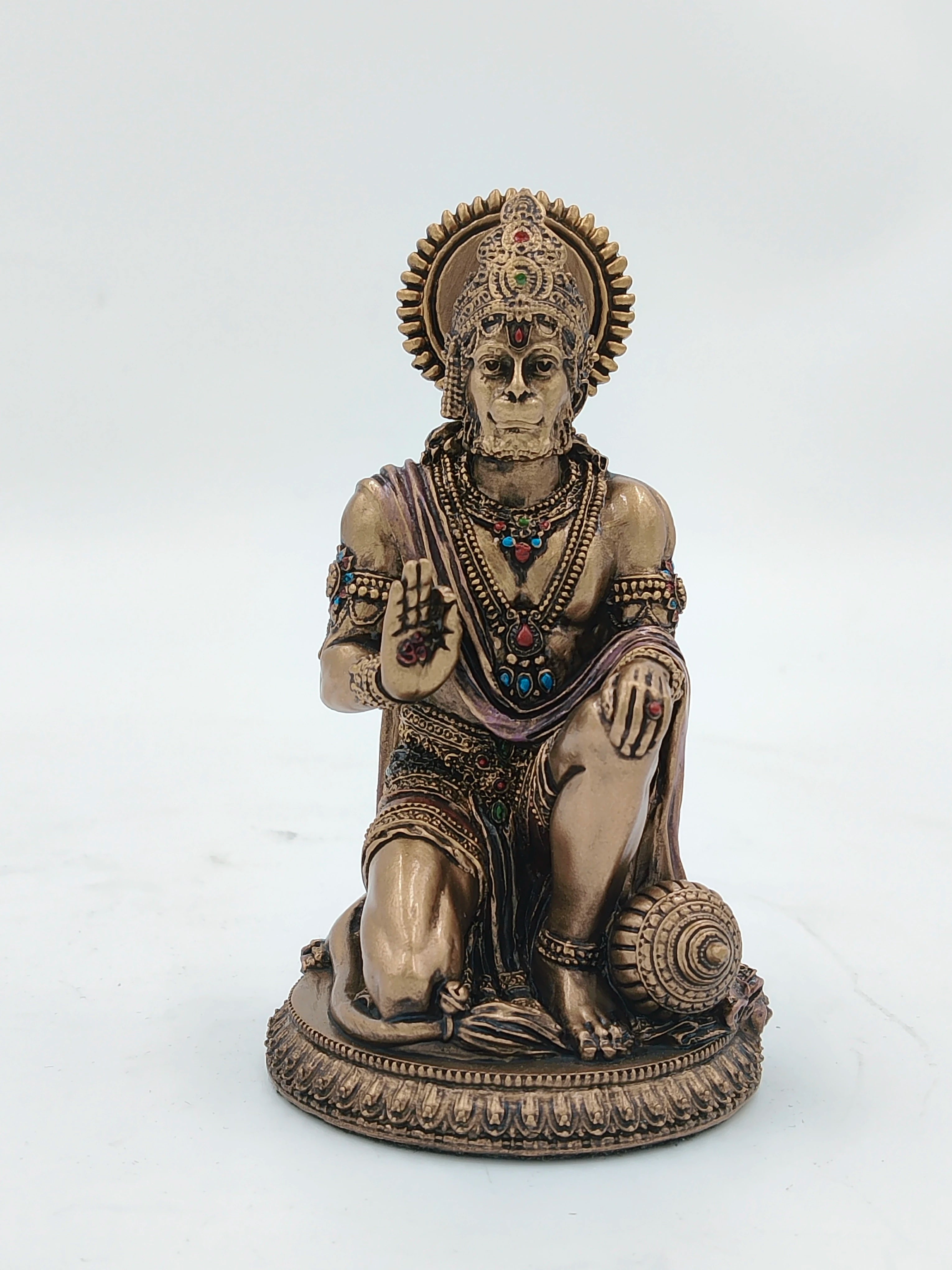 Small polyresin Hanuman statue kneeling with decorated attire and mace