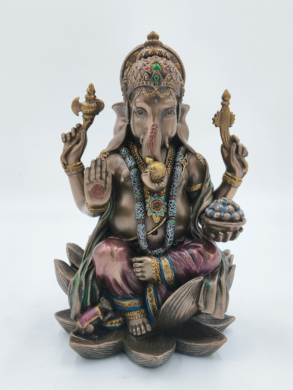 Large polyresin Ganesh statue seated on lotus with four arms and decorative details
