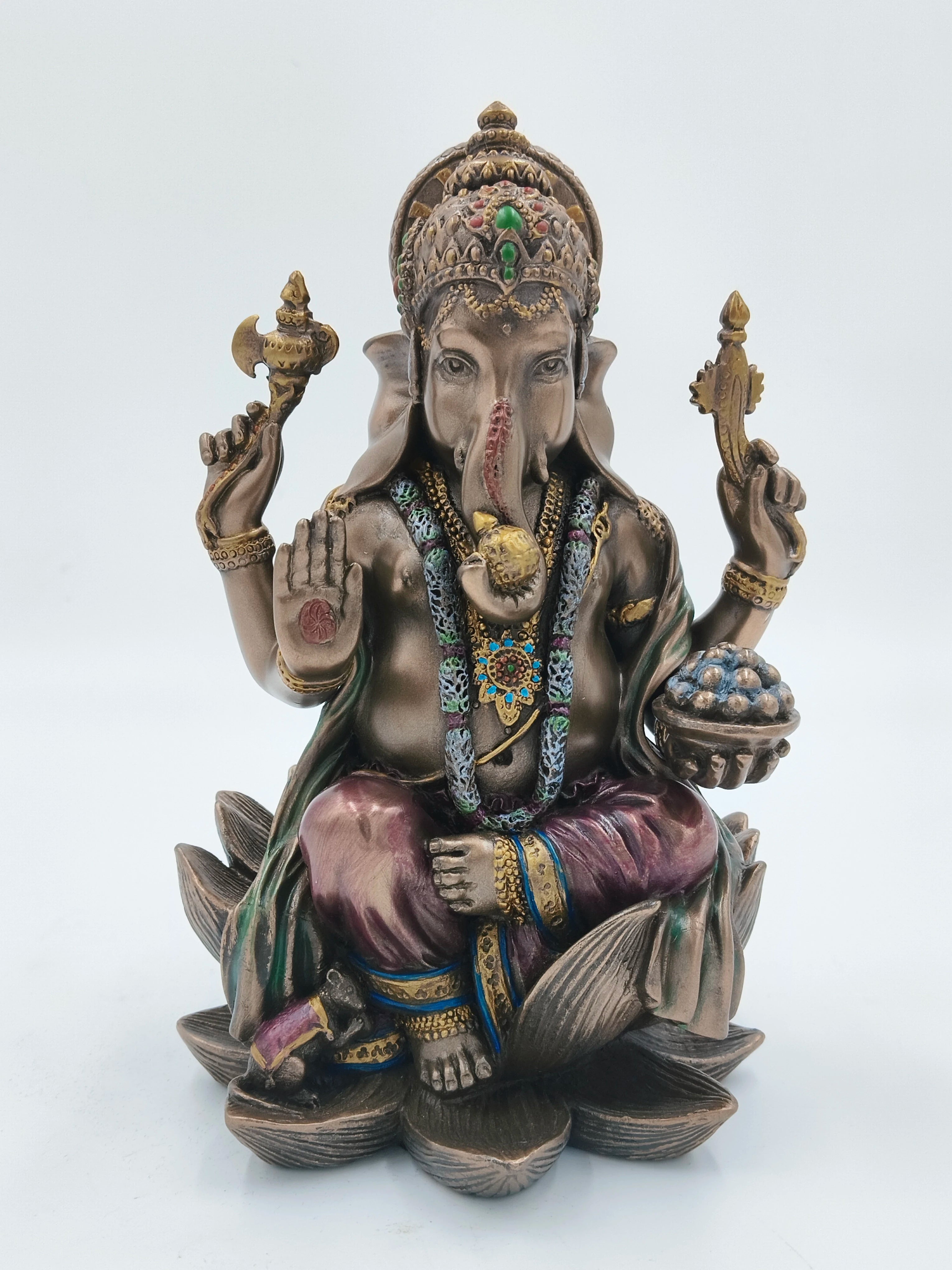 Large polyresin Ganesh statue seated on lotus with four arms and decorative details